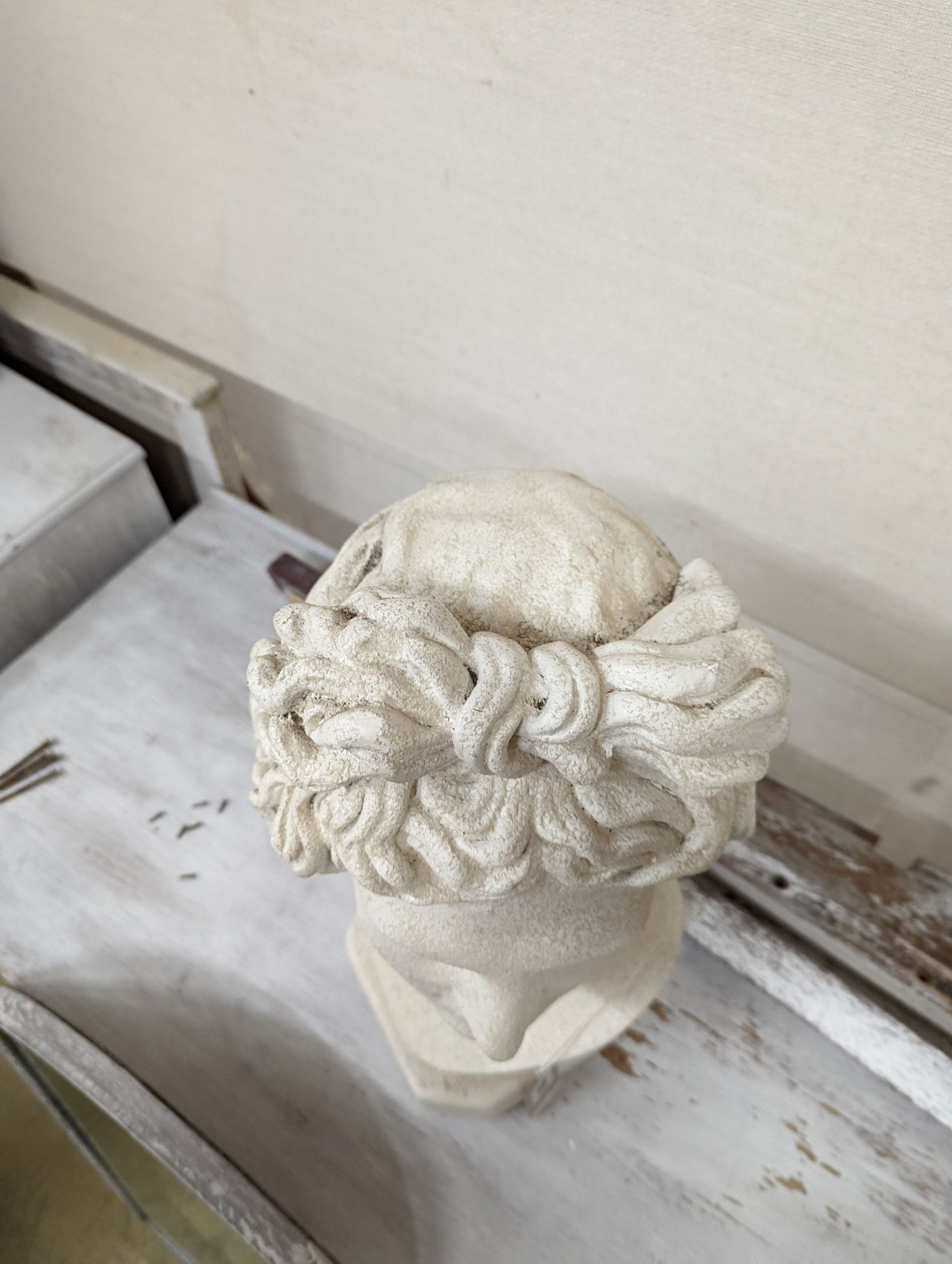 A plaster classical female bust. H-50cm.